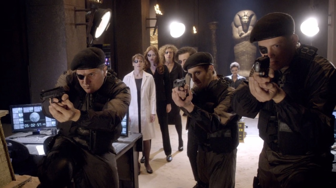 Captain Williams and the soldier on the left face down a threat in “The Wedding of River Song”.