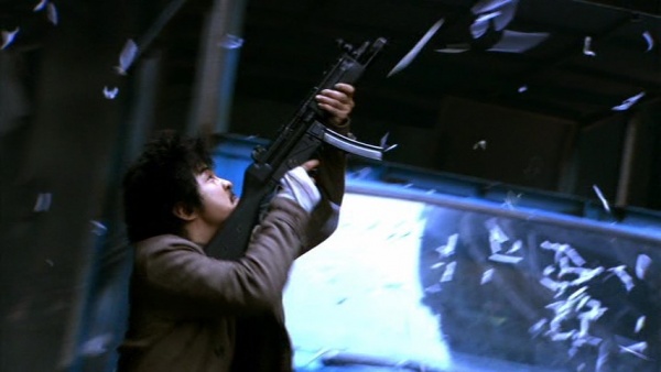 James Lam (Laurence Chou) firing his MP5A2 at Petros' gang. It is fitted with a Surefire 628 dedicated forend weaponlight