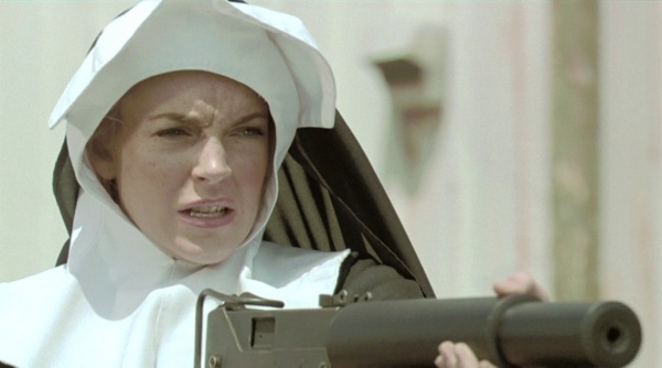 April Booth (Lindsay Lohan) fires a suppressed MAC-10. - 600px-Machete_0510