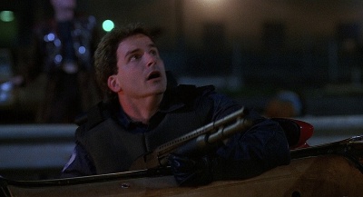 Shane Black with a Mossberg 590 as Donnelly in RoboCop 3 .