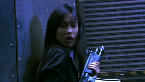 Officer Pak Yut-Suet (Eva Huang) with her MP5A3 at the ready
