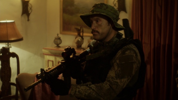 Juan aims his carbine at Doza at the end of "Prisoner's Dilemma" (S2E10).