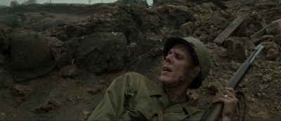 Goran D. Kleut with an M1 Garand as Andy "Ghoul" Walker in Hacksaw Ridge (2016).