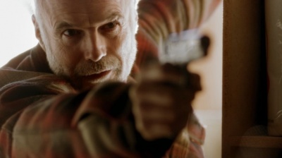 Michael Hogan holds a Springfield Armory M1911 as Ray Till in Numb3rs. - 400px-Numbers_275