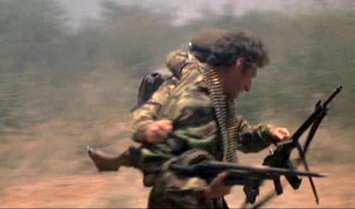 Mercenaries run for the plane, one carrying an SG 510 - 7.62x51mm. The