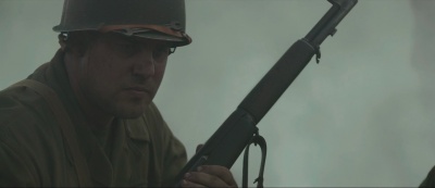 Ben Mingay with an M1 Garand as Grease Nolan in Hacksaw Ridge (2016).