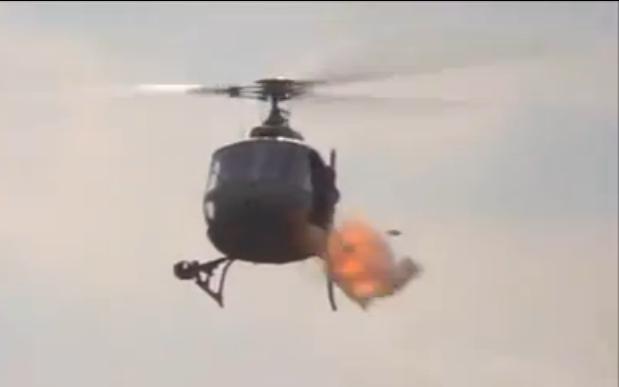 A Eurocopter AS350 Ecureuil shoots rockets.