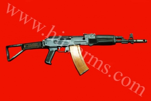 A Vektor R5 modified to resemble an AK-74 - 5.56x45mm NATO. Such conversions were typically made by South Africa movie armorers (with Vektor R4 or R5 rifles), and can also be used to mock up other AK-type firearms. Note the angled receiver design and differently shaped indentation that differentiates the weapon from a genuine AK. © Hire Arms