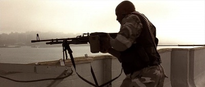 The Marine prepares to drop the empty M60E3.