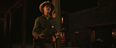 Thomas Brodie-Sangster holds two Single Action Army revolvers as Whitney Winn in Godless.