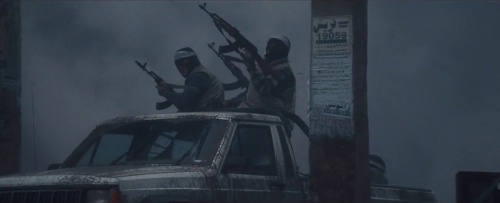 A truck full of Turaqi militia fire at a helicopter with AK-47 and Norinco Type 56 rifles.
