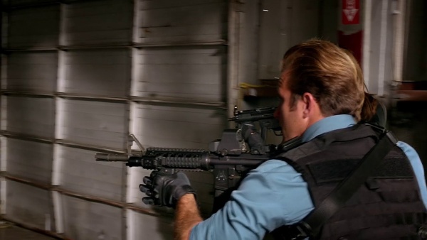 Danno armed with the M4A1. His has a EOTech sight and a vertical foregrip.