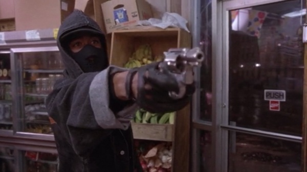 tupac holding a gun