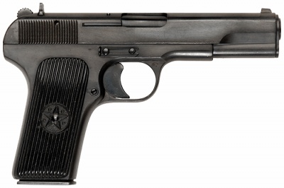 Tokarev TT-33 - 7.62x25mm Tokarev. Post-1947 version. Produced by Tula Arsenal. Note the CCCP printing around the star on the plastic grips.