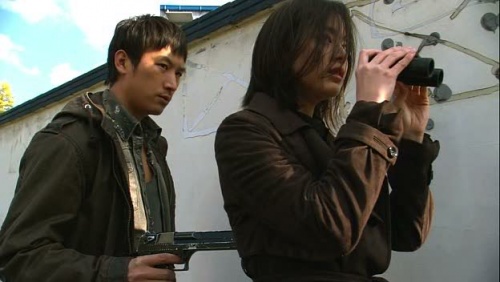 A terrorist holds his Desert Eagle on Seung-Hee